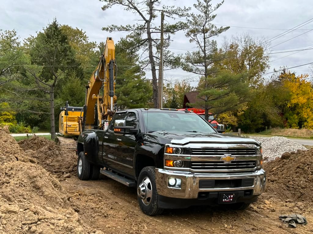 Excavation crew and equipment on site