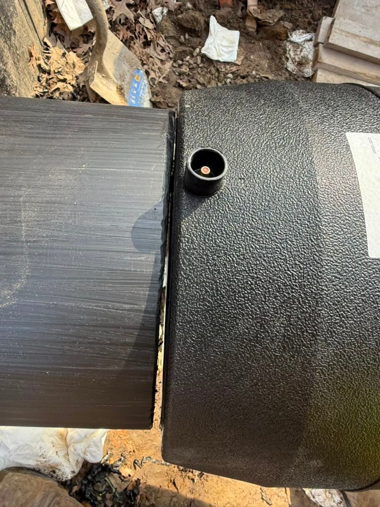 Saddle fitting fused to the top of an HDPE main