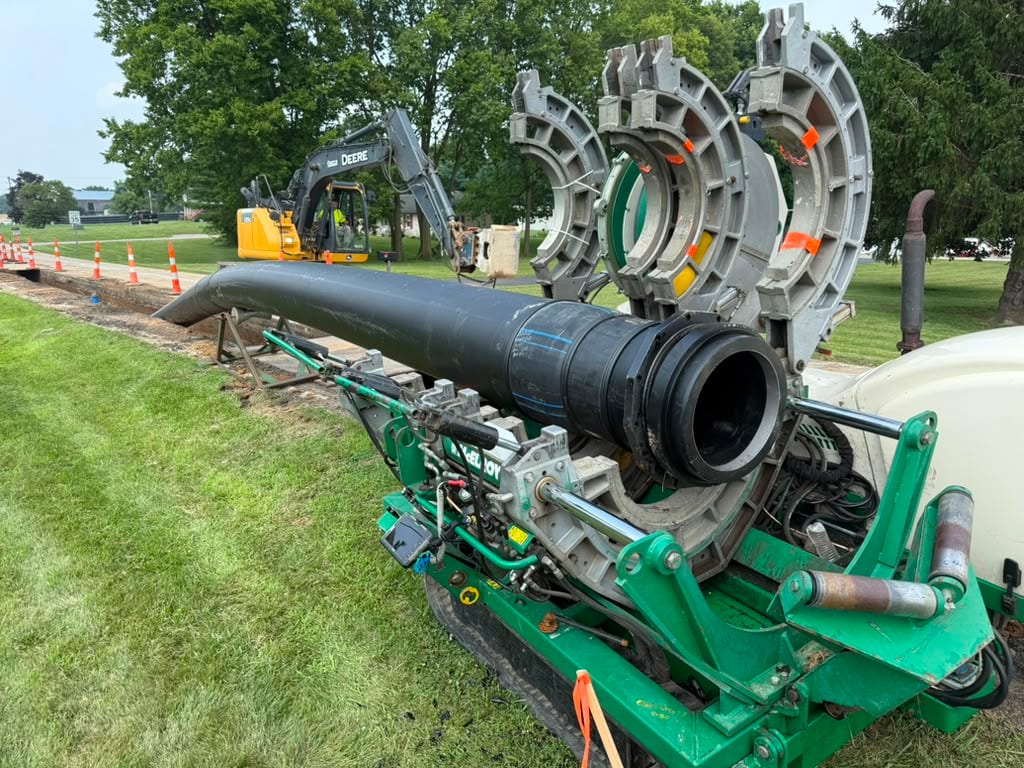 Butt fusion machine with heater plate and faced HDPE pipe end